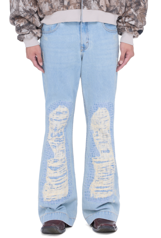 The Beuter Ss25 Flare Distressed Blue Jeans