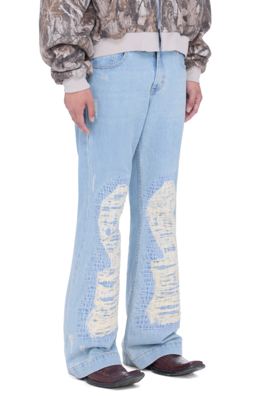 The Beuter Ss25 Flare Distressed Blue Jeans