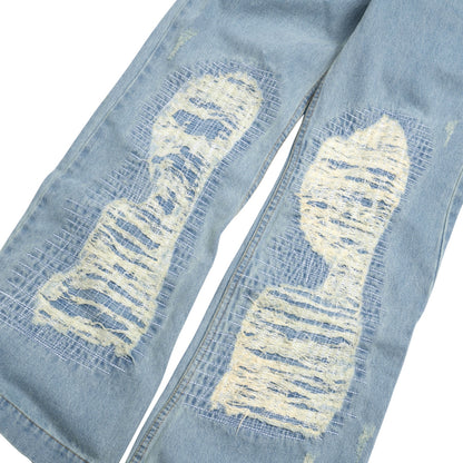 The Beuter Ss25 Flare Distressed Blue Jeans