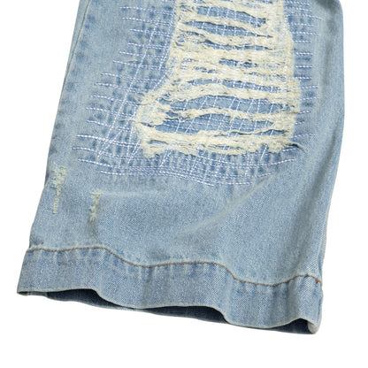 The Beuter Ss25 Flare Distressed Blue Jeans